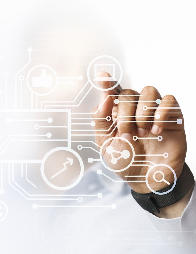 Hand holding a phone showing a stock watchlist
